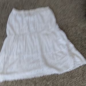 White long skirt with ruffle flowers at the bottom